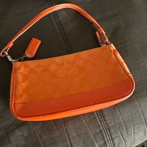 Bright orange mini coach bag. Good- used condition